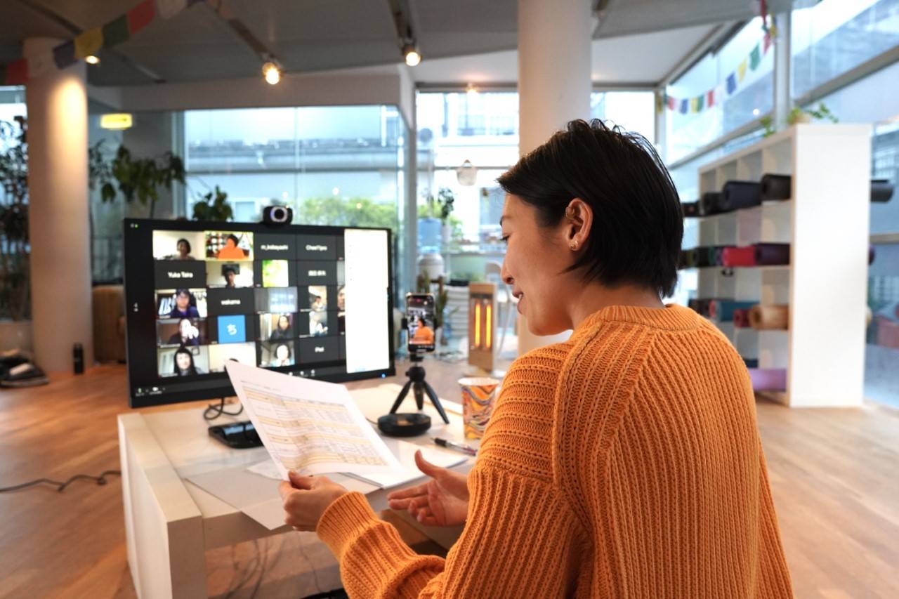 Mae Yoshikawa, founder of yoga studio Veda, helps students cope with the coronavirus pandemic by live-streaming her classes. | CONCEPT STUDIO VEDA / VIA KYODO