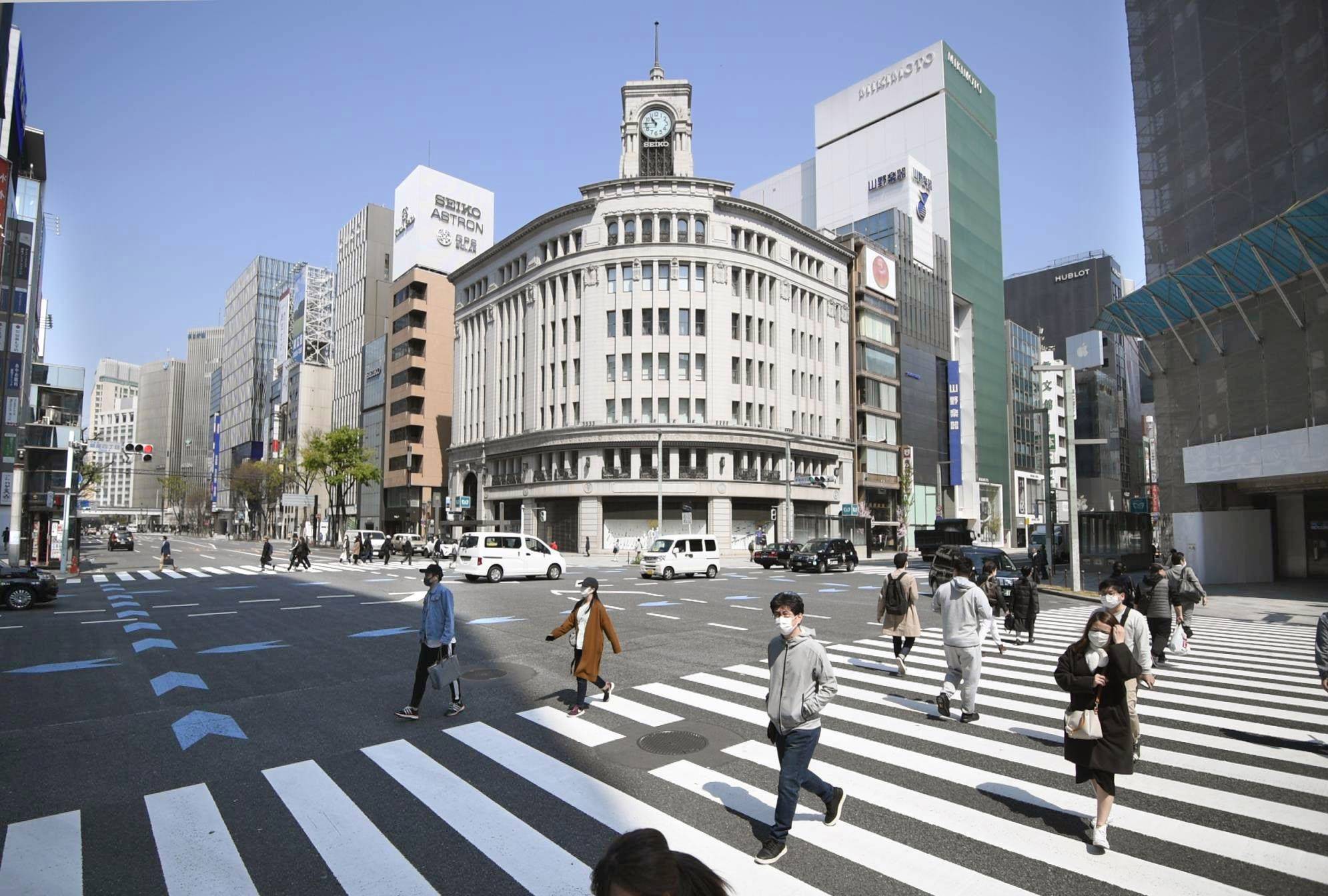 Fewer people than usual are seen in Tokyo's Ginza shopping district on April 4 amid the spread of the new coronavirus. Celebrities in Japan are hosting livestreaming sessions in a bid to keep people entertained while they stay at home. | KYODO
