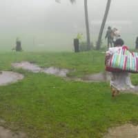Residents evacuate as Tropical Cyclone Harold hits on the northern islands of Vanuatu on Tuesday.  | INTERNATIONAL FEDERATION OF RED CROSS PACIFIC / O. UMUUMULOVO / VIA AFP-JIJI