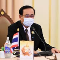 Thai Prime Minister Prayut Chan-ocha takes part in a special Cabinet meeting to discuss measures to stop the spread of the COVID-19 at the Government House in Bangkok. | ROYAL THAI  GOVERNMENT / VIA AFP-JIJI