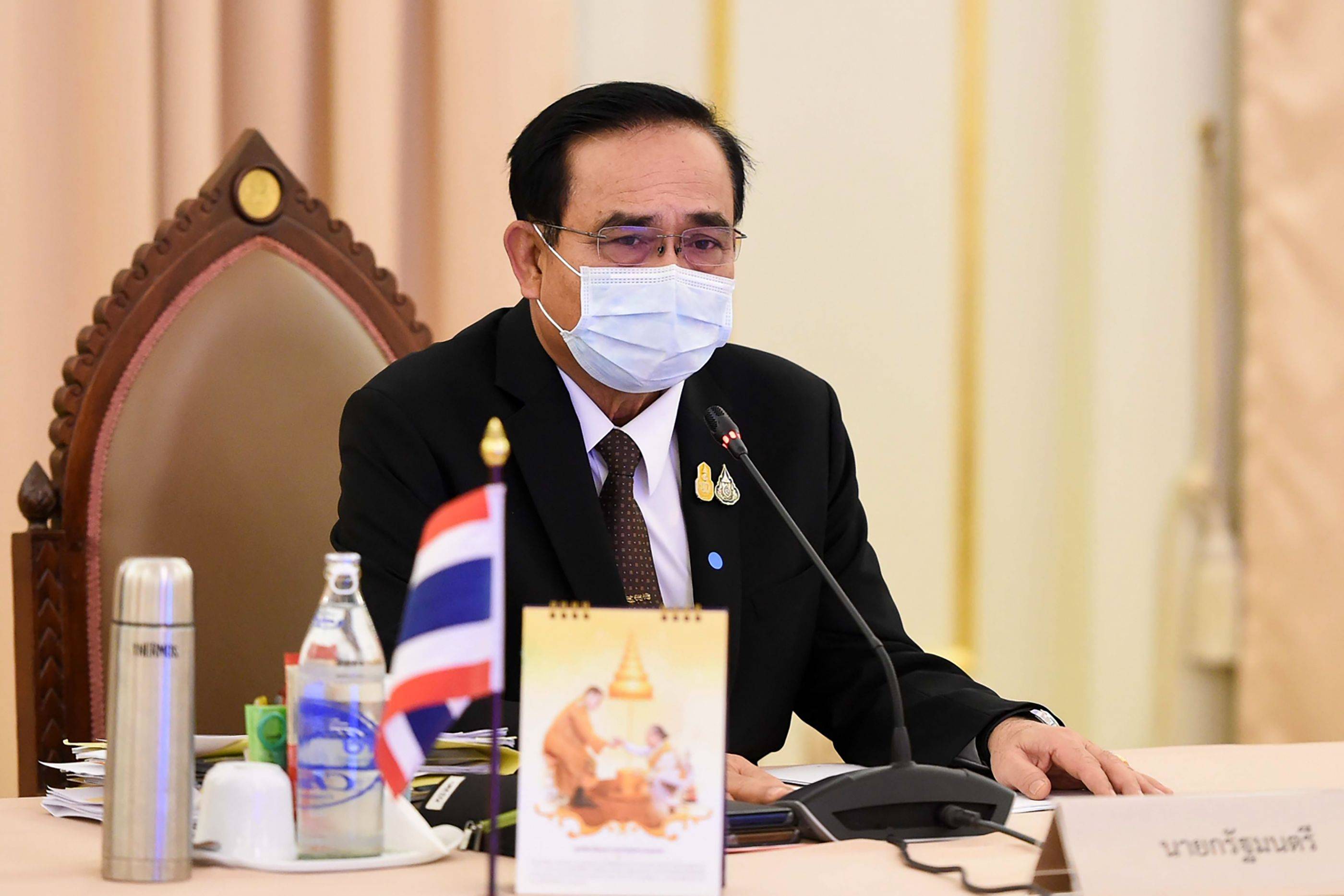 Thai Prime Minister Prayut Chan-ocha takes part in a special Cabinet meeting to discuss measures to stop the spread of the COVID-19 at the Government House in Bangkok. | ROYAL THAI  GOVERNMENT / VIA AFP-JIJI