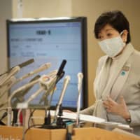 Tokyo Gov. Yuriko Koike speaks at a news conference on Friday to announce the capital\'s plan to defeat the coronavirus outbreak by May 6, when the central government\'s state of emergency is due to be lifted. | RYUSEI TAKAHASHI

