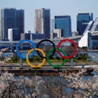 Rings of uncertainty: Olympic rings sit at Odaiba Marine Park in Tokyo on March 25, one day after the announcement of the games’ postponement due to the outbreak of the new coronavirus. | REUTERS