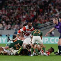 Michael Leitch looks toward the referee during a scrum in the Rugby World Cup quarterfinal between Japan and South Africa on Oct. 19, 2019, in Tokyo. | DAN ORLOWITZ