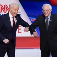 Former Vice President Joe Biden and Sen. Bernie Sanders greet each other before a debate in Washington in March. | AP