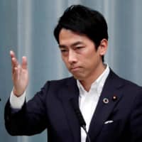 Environment Minister Shinjiro Koizumi attends a news conference at the Prime Minister\'s Office in Tokyo in September.  | REUTERS