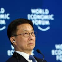 Chinese Vice Premier Han Zheng attends a session at the 50th World Economic Forum annual meeting in Davos, Switzerland, in January. | REUTERS