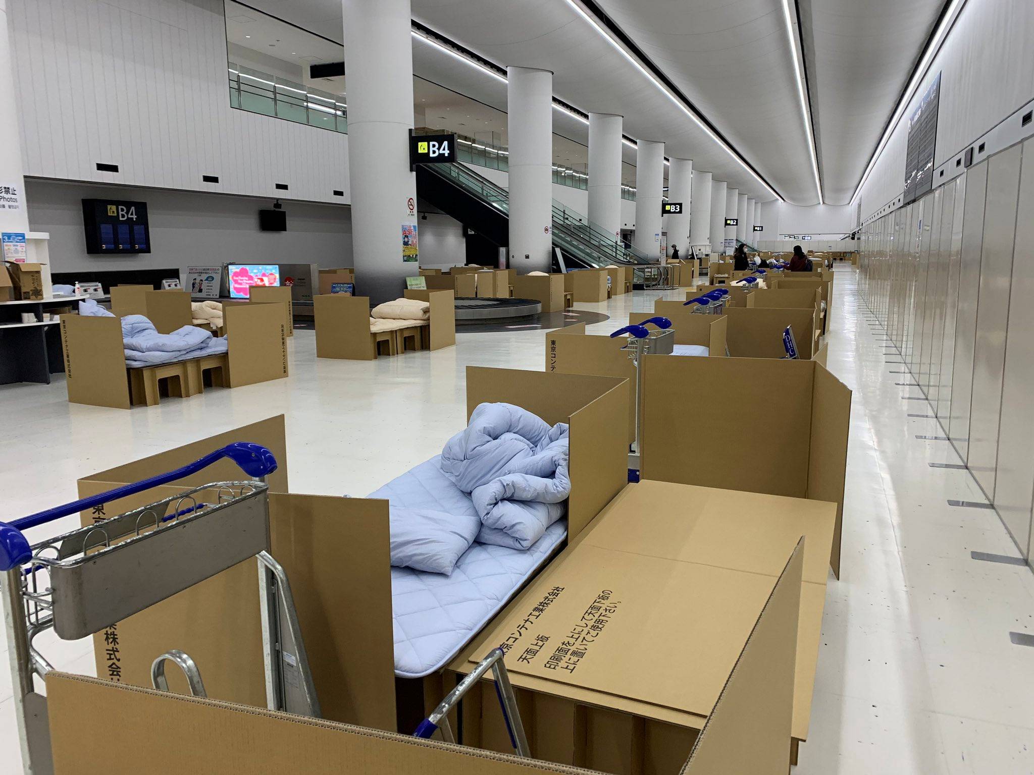 Cardboard beds are used to temporarily quarantine passengers as they wait for COVID-19 test results, at Narita Airport in Chiba Prefecture on April 9, in this photo obtained from social media. | TWITTER/@WASABI1094 / VIA REUTERS