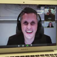 Box Inc. CEO Aaron Levie gives an interview via a video conference system in March. | WAICHI SEKIGUCHI