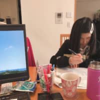 Junko Sugiyama has been working from home alongside her 11-year-old daughter, Miyu, since schools around Japan closed on March 2. | COURTESY OF JUNKO SUGIYAMA
