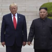 U.S. President Donald Trump meets with North Korean leader Kim Jong Un on the North Korean side of the border at the village of Panmunjom, in the Demilitarized Zone, in June 2019. | AP