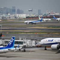 Falling demand for air travel due to the coronavirus pandemic has forced ANA Holdings Inc. to cut its earnings estimate sharply for the 2019 business year through March. | AFP-JIJI