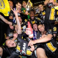 Lokeren players celebrate winning the Belgian Cup against Zulte Waregem on March 22, 2014, in Brussels. | REUTERS