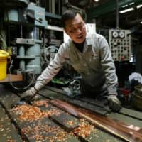 Small or medium-size companies are the cornerstone of Japan\'s service sector and play a critical role in the manufacturing and export supply chain. | REUTERS