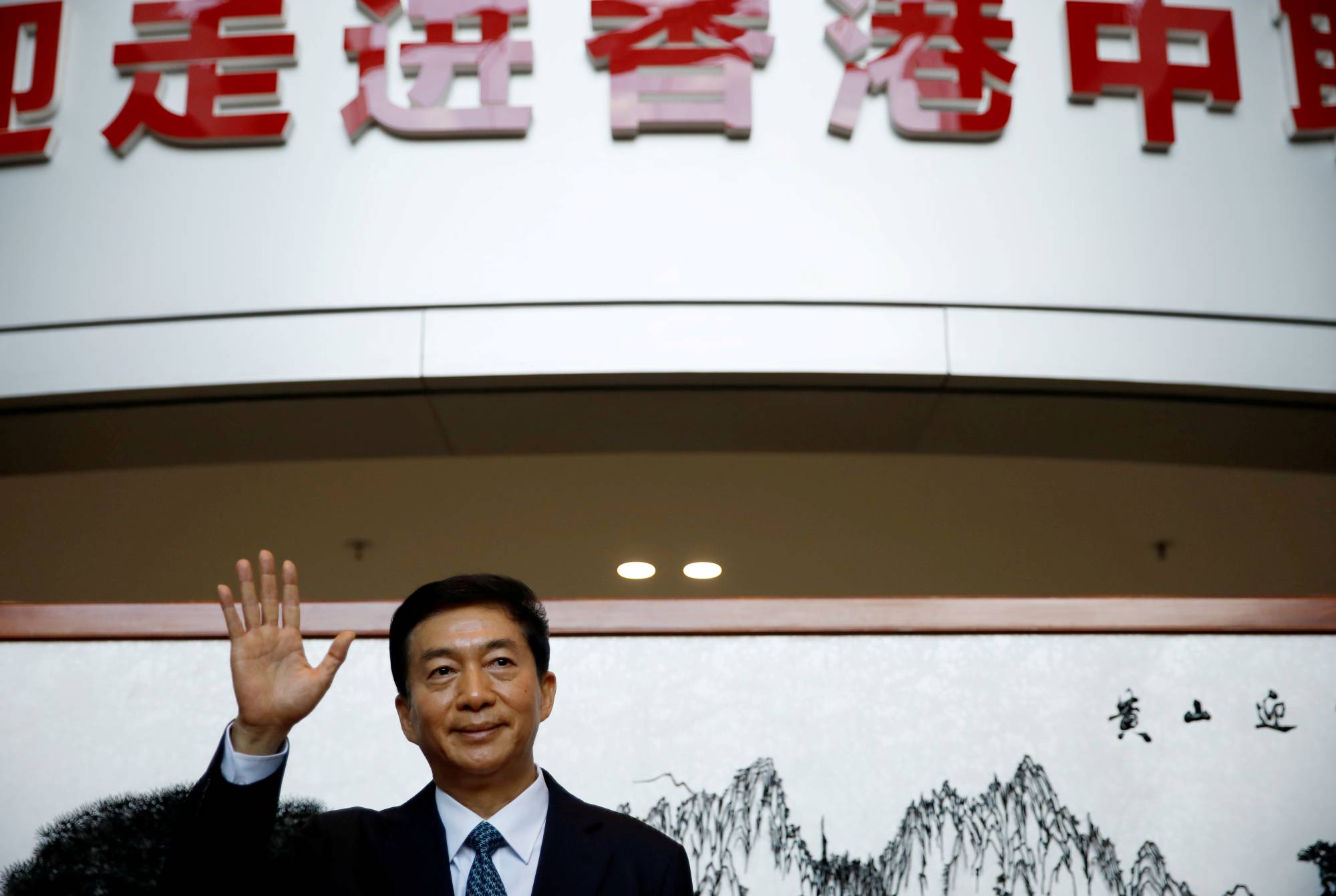 Luo Huining, head of China's Hong Kong Liaison Office, speaks to media to mark his first day in the post in Hong Kong on Jan. 6. | REUTERS 