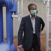 Former pro-democracy lawmaker Martin Lee, 81, leaves a police station in Hong Kong on Saturday. | AP