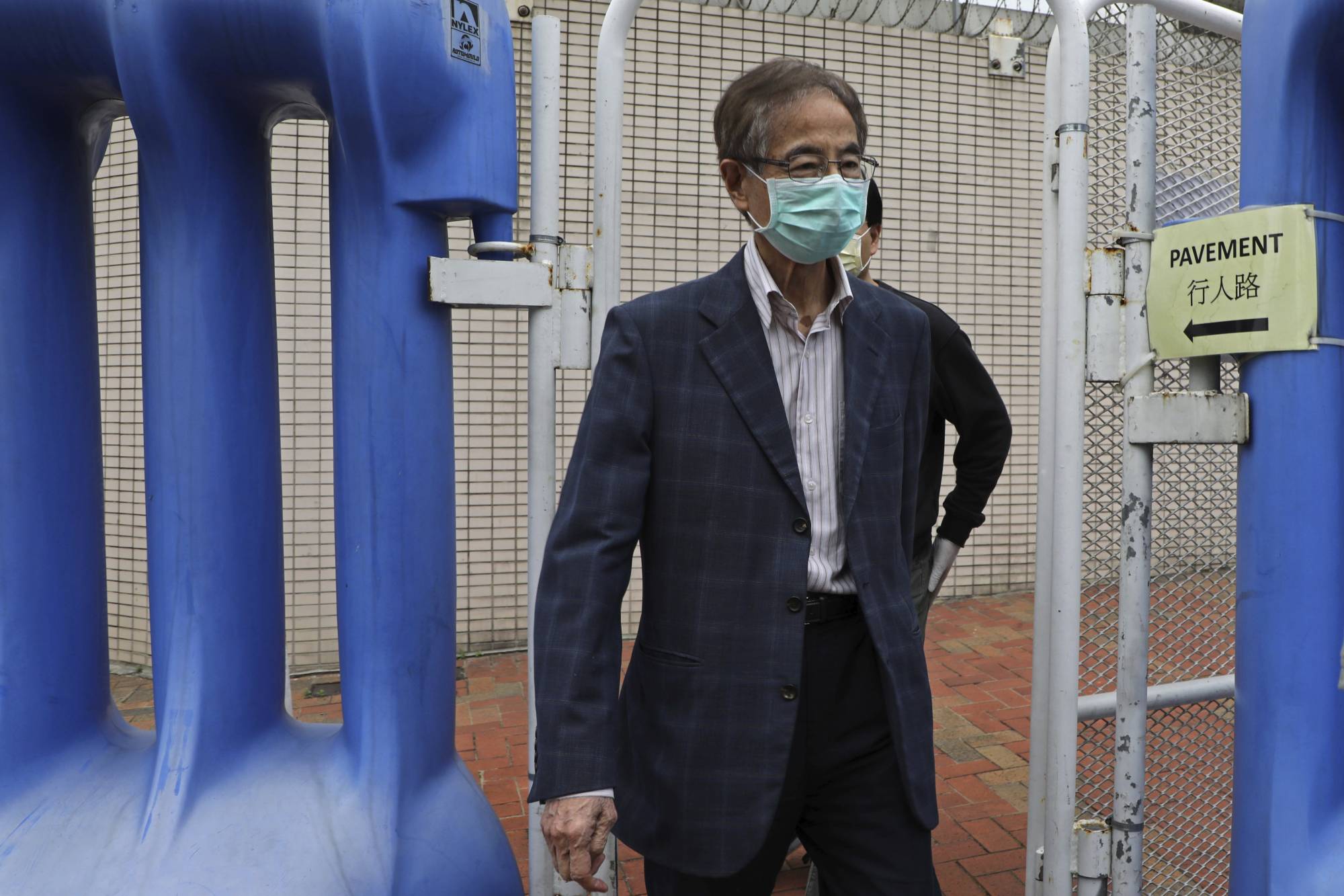 Former pro-democracy lawmaker Martin Lee, 81, leaves a police station in Hong Kong on Saturday. | AP