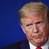 U.S. President Donald Trump reacts during a briefing at the White House on Wednesday.  | AFP-JIJI