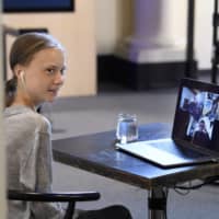 Environmental activist Greta Thunberg speaks during a live chat on International Earth Day at the Nobel Museum in Stockholm on Wednesday.  | TT NEWS AGENCY / VIA AP