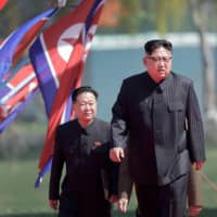 North Korean leader Kim Jong Un and Choe Ryong Hae, vice-chairman of the central committee of the Workers\' Party, arrive for the official opening of the Ryomyong residential area, in Pyongyang, North Korea, on April 13. | AP