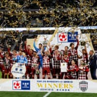 Vissel Kobe players celebrate after winning the 99th edition of the Emperor\'s Cup on Jan. 1 at Tokyo\'s new National Stadium. | REUTERS