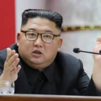 North Korean leader Kim Jong Un attends a session of the ruling Workers\' Party of Korea\'s Central Committee in Pyongyang in this image released Jan. 1. | KCNA / KNS / VIA AFP-JIJI