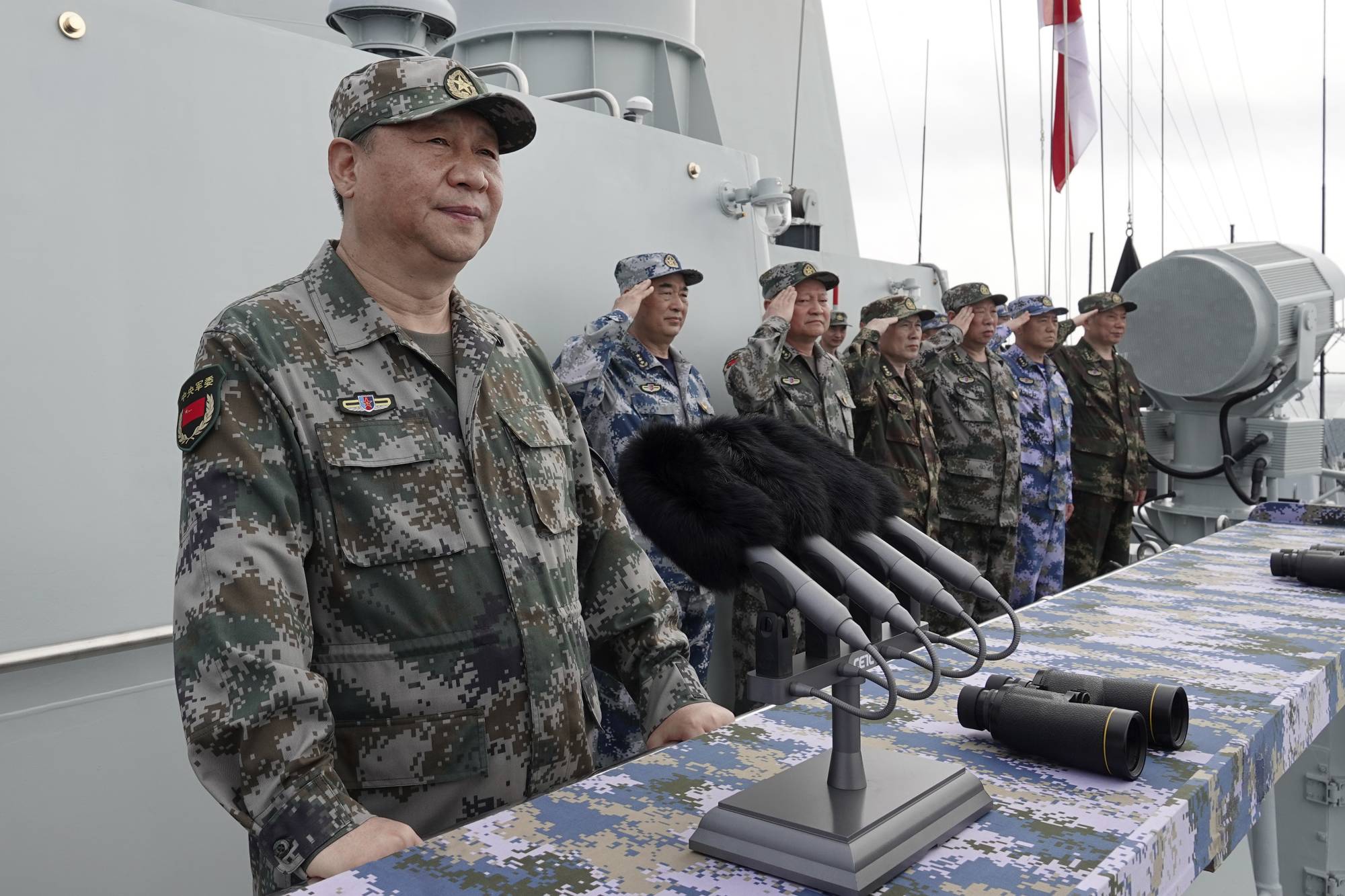 Chinese President Xi Jinping speaks after he reviewed the Chinese People's Liberation Army (PLA) Navy fleet in the South China Sea in 2018. | XINHUA / VIA AP