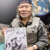 This undated photo shows Leiji Matsumoto holding an illustration from the animation series \"Space Pirate Captain Herlock.\" | KYODO