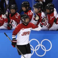 Japan\'s Shiori Koike celebrates with her teammates after scoring against Sweden during the women\'s classification game at the 2018 Pyeongchang Olympics on Feb. 18, 2018, in Gangneung, South Korea. | REUTERS