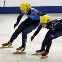Viktor Ahn (left) of Russia and Sin Da-woon South Korea compete in the men\'s 1500-meter final during the ISU Short Track World Cup speed skating competition in Shanghai on Dec 8, 2012. | REUTERS