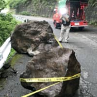 Rocks that fell during a quake lie on a road in Otaki, Nagano Prefecture, on June 25, 2017. | KYODO
