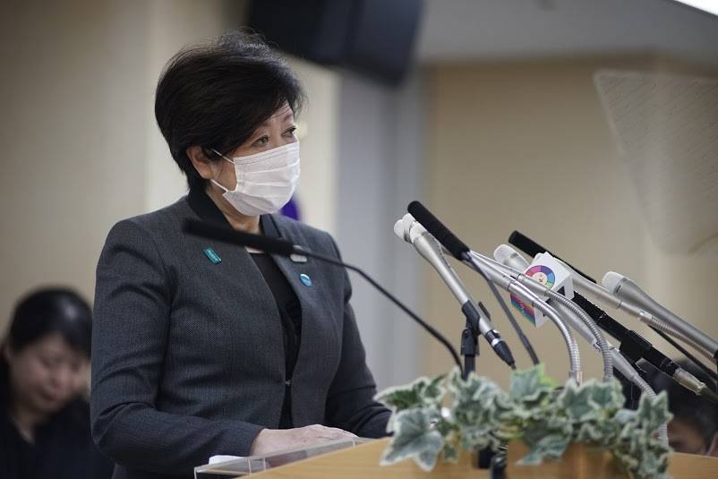 Tokyo Gov. Yuriko Koike speaks with a mask on while urging residents to further isolate themselves, during a news conference on April 24. | RYUSEI TAKAHASHI