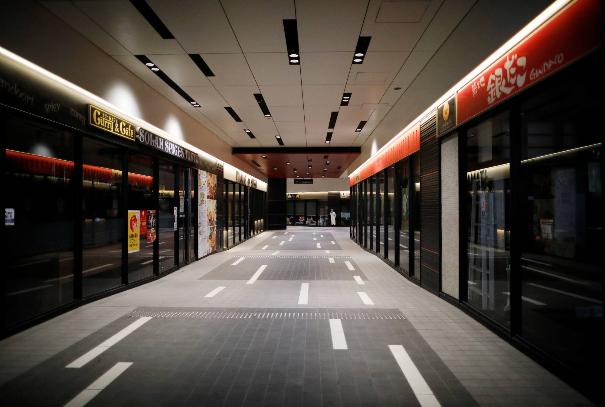 A shopping and entertainment complex is almost fully closed in the Kabukicho district of Tokyo, after the government announced a state of emergency as the new coronavirus spread in the country, on April 13, 2020. | REUTERS