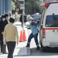 An ambulance arrives at a Tokyo hospital accepting COVID-19 patients in January. | KYODO