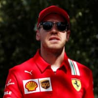 Ferrari racer Sebastian Vettel speaks during the Australian Grand Prix media day on March 12 in Melbourne. | REUTERS