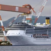 The Costa Atlantica cruise ship is docked at a port in the city of Nagasaki on Sunday. | KYODO 