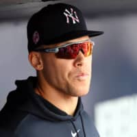 Yankees right fielder Aaron Judge looks on from the dugout during a spring training game against the Braves on March 8 in Tampa, Florida. | USA TODAY / VIA REUTERS