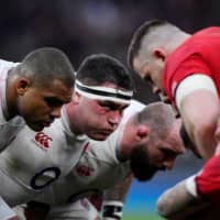 England\'s Jamie George, Kyle Sinckler and Joe Marler line up in a scrum during a Six Nations match against Wales on March 7 in London. | REUTERS