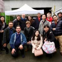 Taste test: Yuki Imanishi (front row, far right) leads a sake tasting tour to Inoue Sake Brewery in Kanagawa Prefecture. | COURTESY OF YUKI IMANISHI

