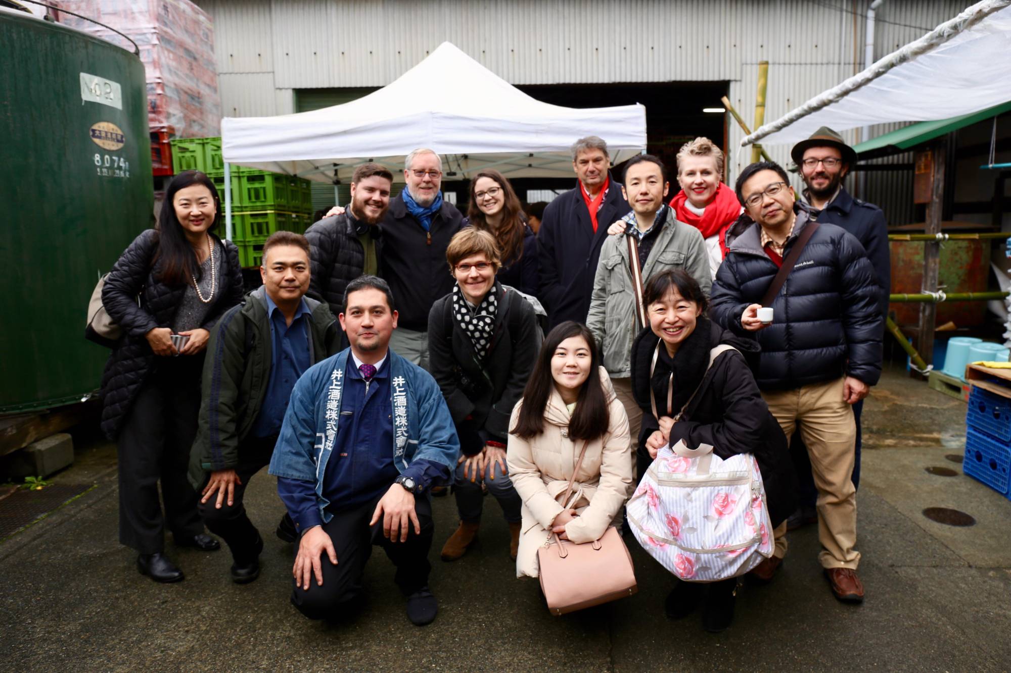Taste test: Yuki Imanishi (front row, far right) leads a sake tasting tour to Inoue Sake Brewery in Kanagawa Prefecture. | COURTESY OF YUKI IMANISHI 