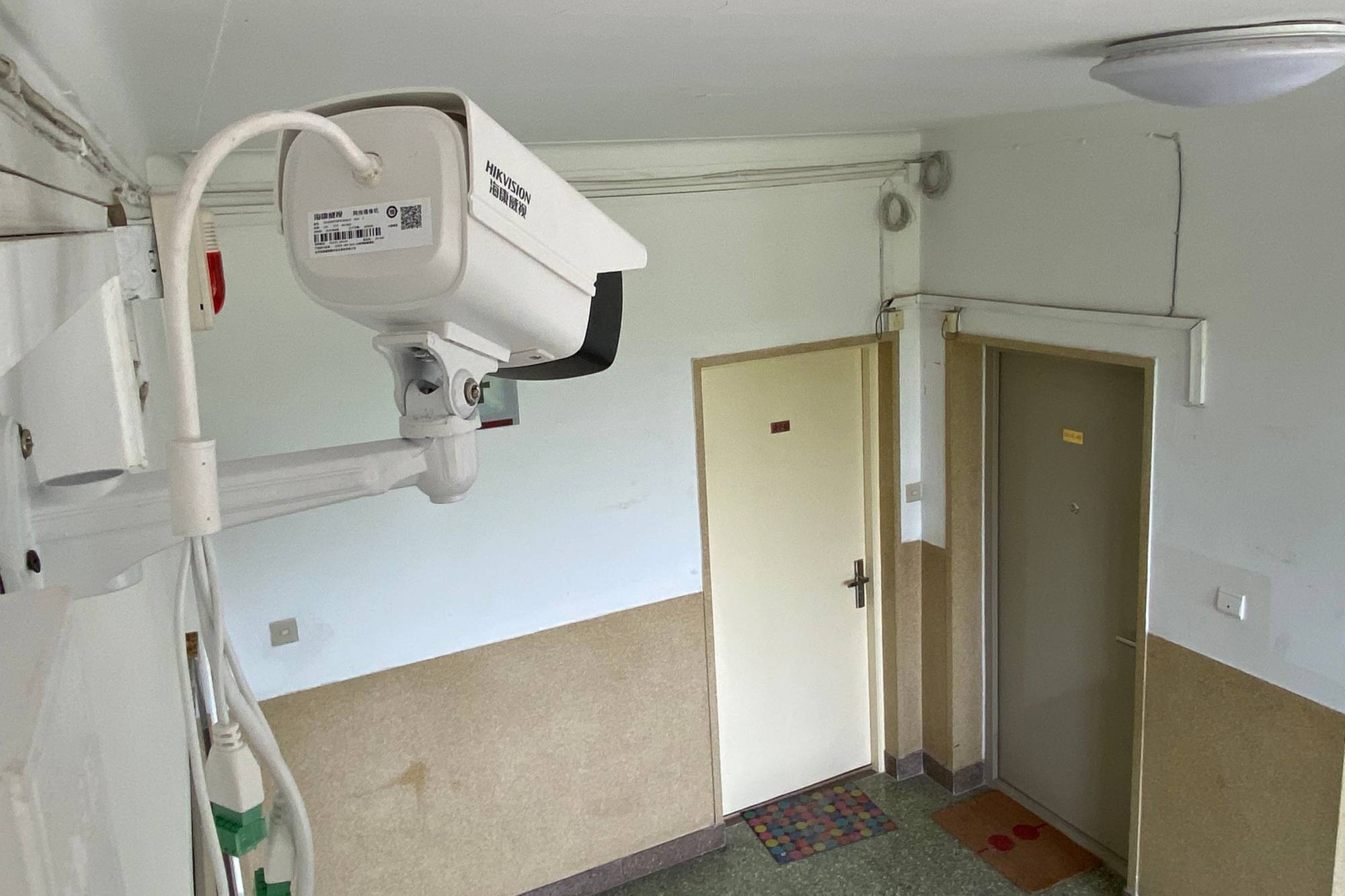 A surveillance camera keeps watch May 3 outside the Beijing home of a journalist who was placed under quarantine after visiting Wuhan.  | AFP-JIJI
