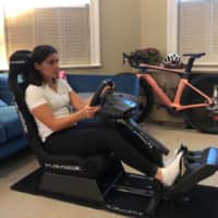 W Series champion Jamie Chadwick drives on her esports setup in her apartment in London on Tuesday. | JAMIE CHADWICK / VIA REUTERS
