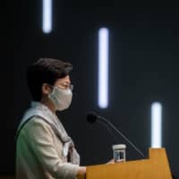 Carrie Lam, Hong Kong\'s chief executive, speaks during a news conference on Tuesday. A year after protests erupted in the city, Lam is again pushing ahead with politically divisive policies — and she’s no longer expressing concern about the fallout. | BLOOMBERG