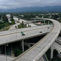 A nearly empty freeway intersection near Los Angeles amid the COVID-19 pandemic.  | REUTERS