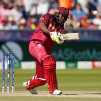 The West Indies\' Chris Gayle competes against Sri Lanka during the ICC Cricket World Cup on July 1, 2019, in Chester-le-Street, Britain. | REUTERS