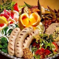 Mega munchies: Hibino Beer’s new deluxe set of hor d’oeuvres has proved popular with a wide range of the bar’s customers. | COURTESY OF KEIJI NISHIO, HIBINO BEER
