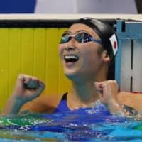 Rikako Ikee celebrates after winning the women\'s 50-meter Freestyle at the Asian Games on Aug. 24, 2018, in Jakarta. | REUTERS