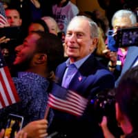 Then-Democratic U.S. presidential candidate Michael Bloomberg greets supporters during his Super Tuesday night rally in West Palm Beach, Florida, on March 3. | REUTERS