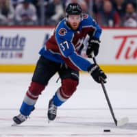 Avalanche left wing J.T. Compher controls the puck against the Senators during a Feb. 11 game in Denver. | USA TODAY / VIA REUTERS
