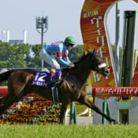 Almond Eye, ridden by Christophe Lemaire, wins the 15th running of the Victoria Mile on Sunday at Tokyo Racecourse. | KYODO